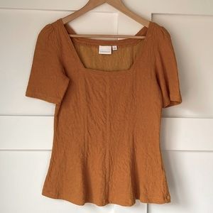 Anthropologie • mustard textured swing top • size S